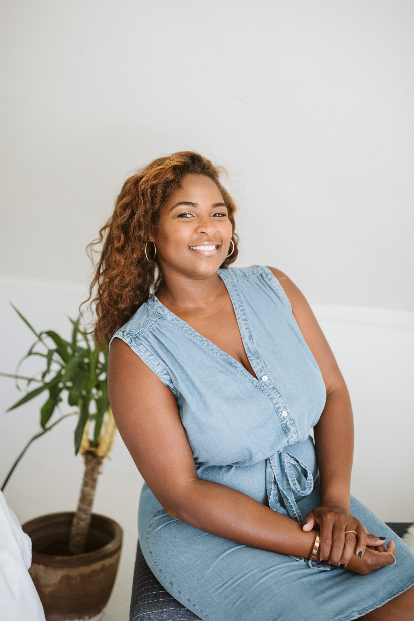 fresh face brown skin woman in blue jean dress