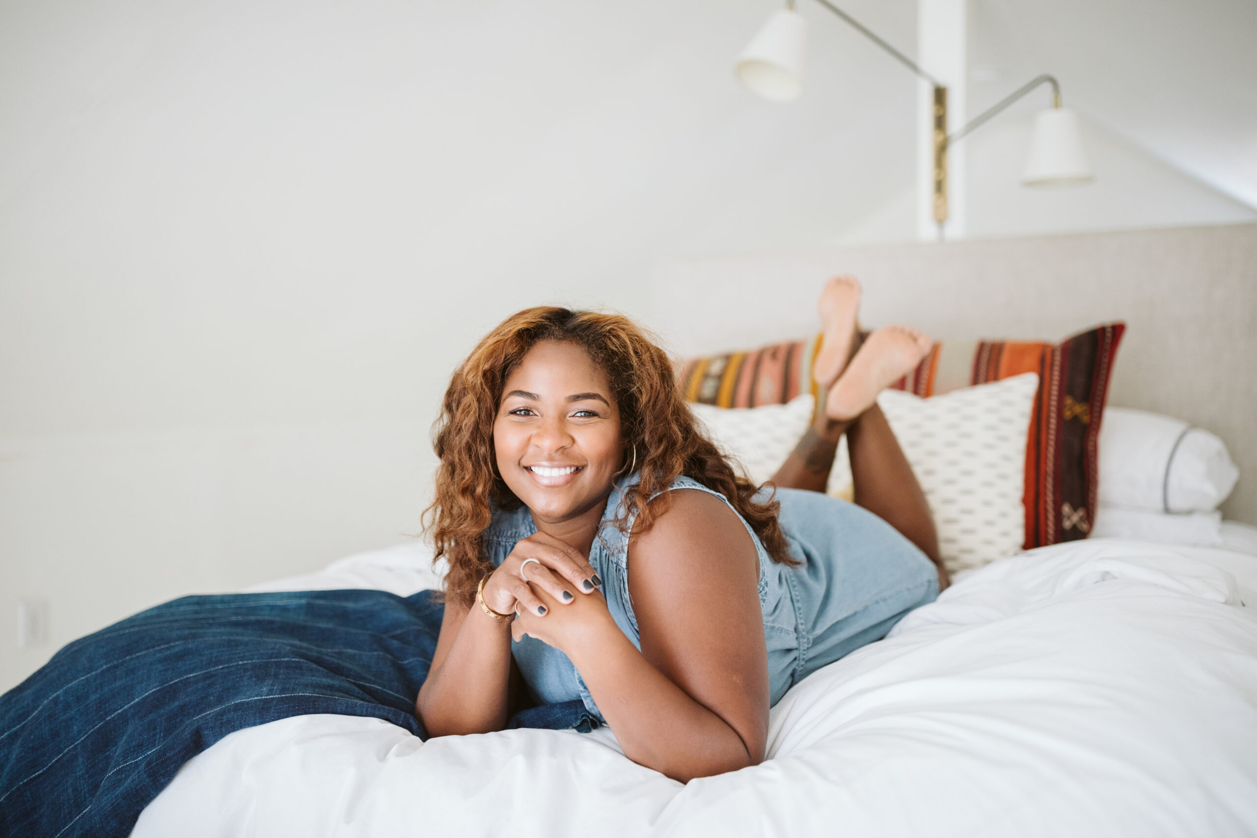 fresh face brown skin woman in blue jean dress